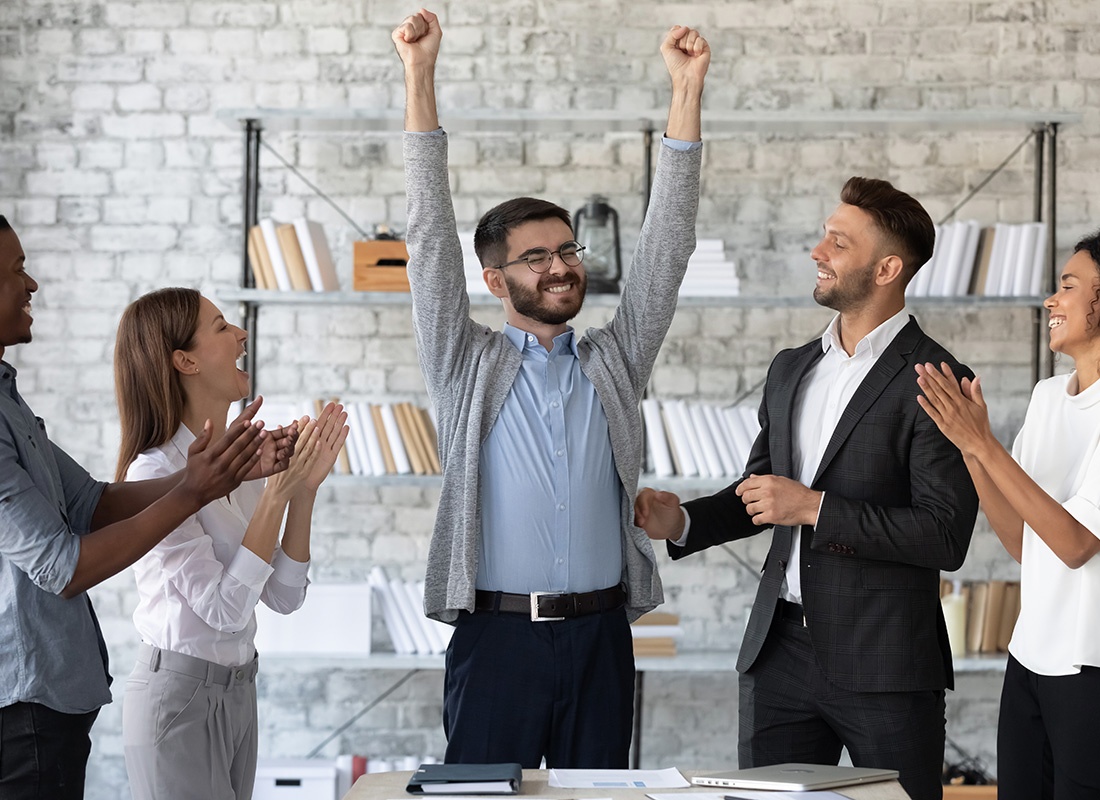 Insurance Solutions - Business People Applauding and Cheering in an Office